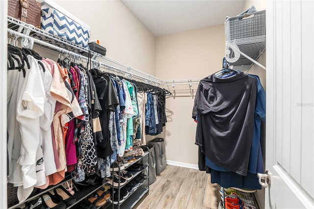 spacious closet featuring hardwood / wood-style flooring