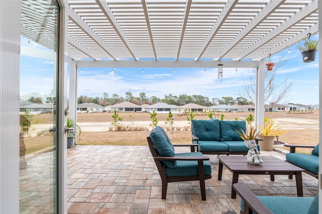 view of patio featuring an outdoor living space and a pergola