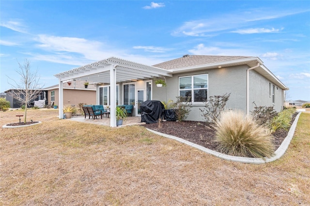 back of property featuring a yard, a patio area, and a pergola