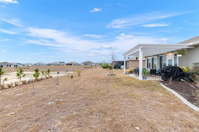 view of yard featuring a pergola and a patio area