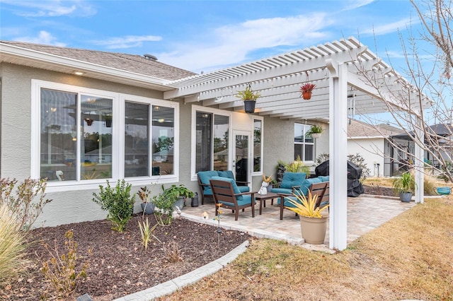 view of patio with area for grilling, an outdoor hangout area, and a pergola