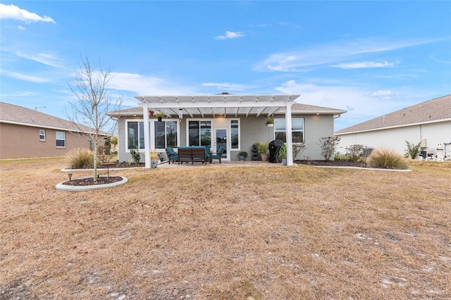 back of property featuring outdoor lounge area, a yard, a patio area, and a pergola