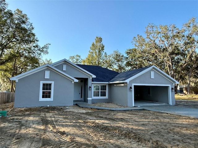 single story home featuring a garage