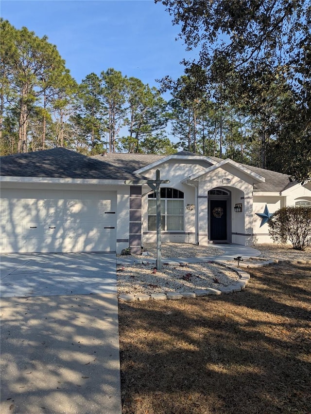 single story home with a garage