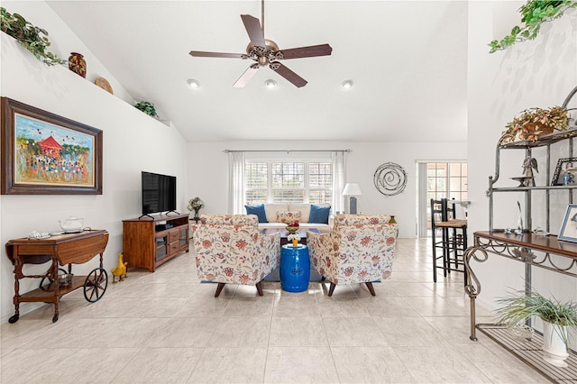 living room featuring light tile patterned floors, a wealth of natural light, high vaulted ceiling, and ceiling fan