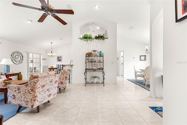 tiled living room with ceiling fan with notable chandelier and high vaulted ceiling