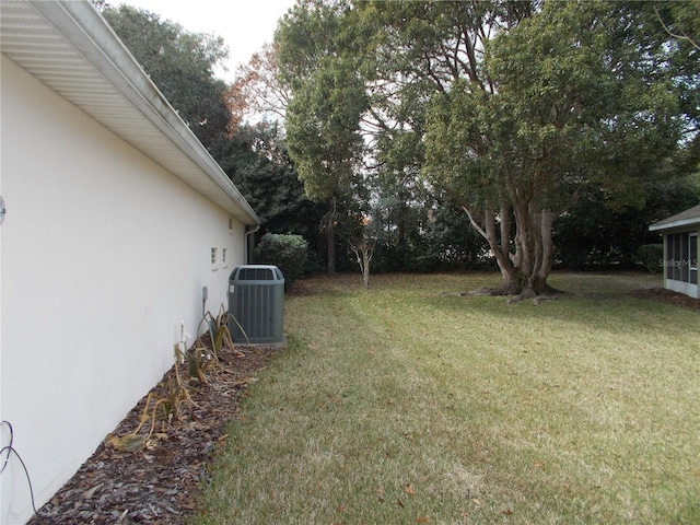 view of yard featuring central air condition unit