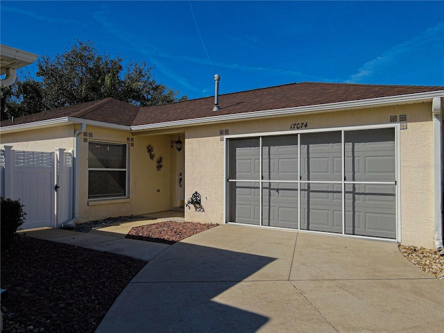 ranch-style house featuring a garage