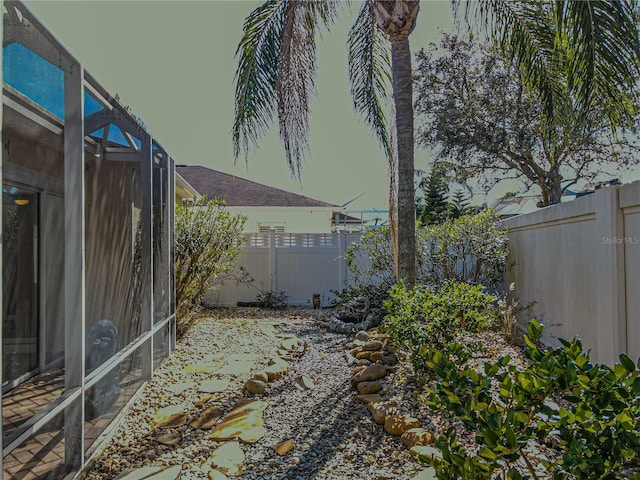 view of yard with a lanai