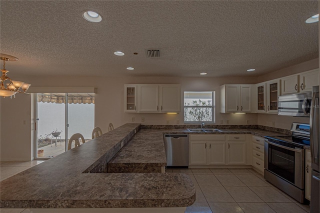 kitchen featuring white cabinetry, appliances with stainless steel finishes, and sink