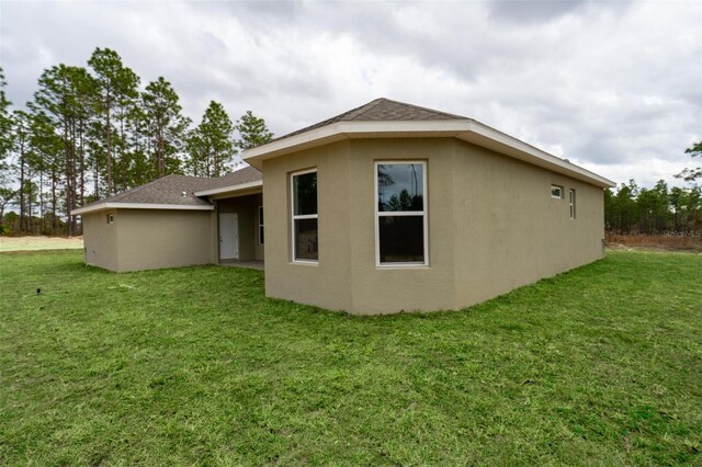 view of property exterior featuring a lawn