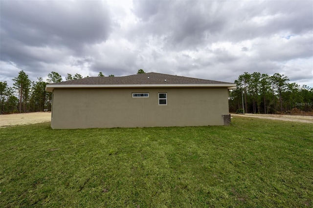 view of home's exterior with a lawn