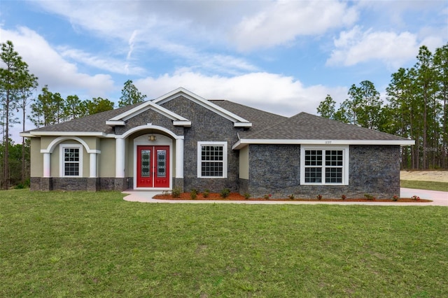 craftsman inspired home with a front yard and french doors