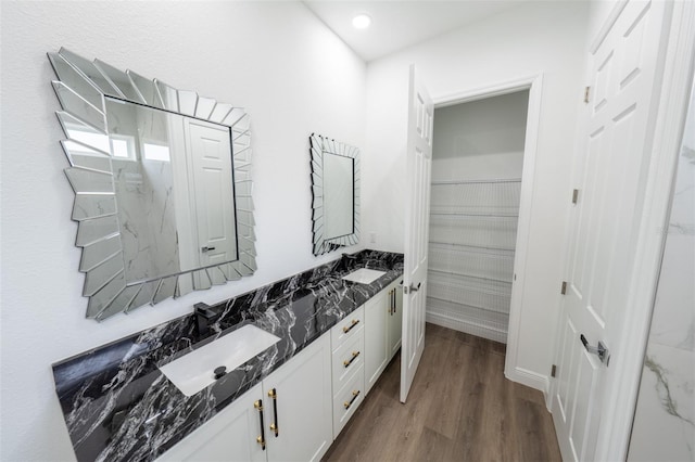 bathroom with vanity and hardwood / wood-style floors