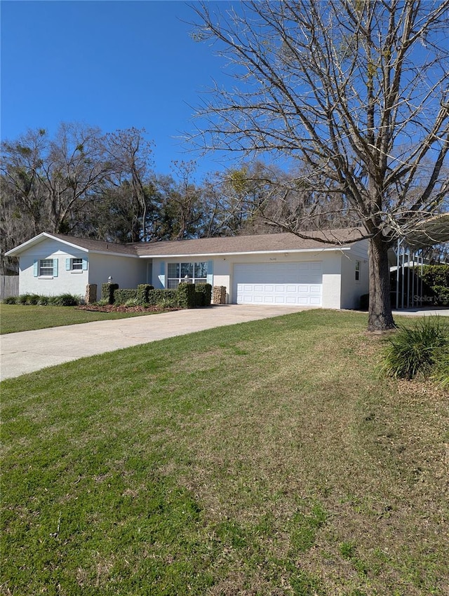 single story home with an attached garage, concrete driveway, a front yard, and stucco siding