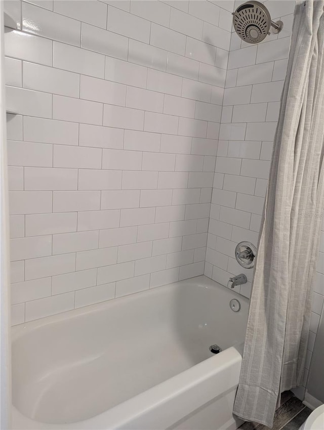 full bath featuring shower / tub combo