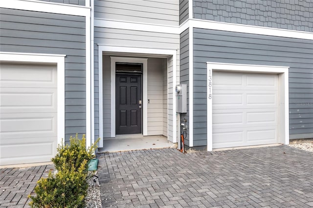 property entrance with a garage