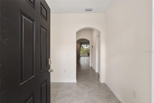 hallway with light tile patterned flooring