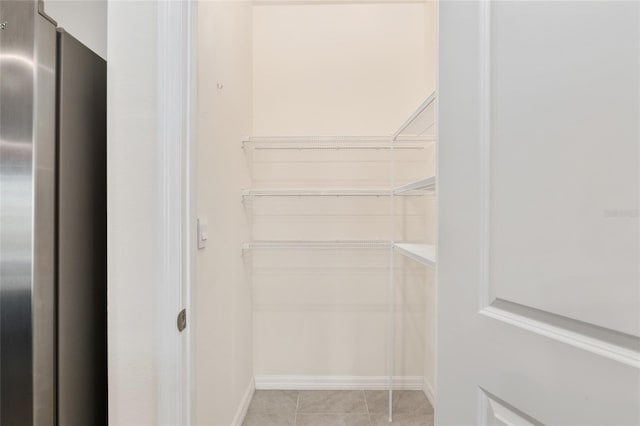 13818 NW 9th Rd, Newberry, FL 32669 - walk in closet with light tile patterned floors