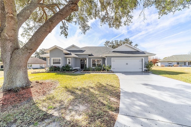 view of front facade with a garage and a front lawn