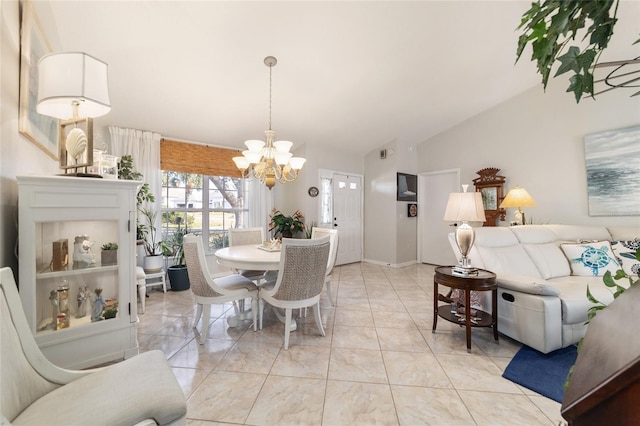 dining space featuring lofted ceiling, light tile patterned floors, and a chandelier