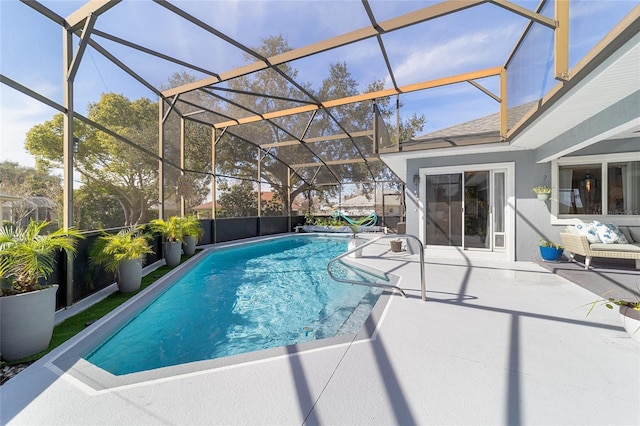 view of pool featuring a lanai and a patio area