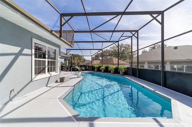 view of pool featuring a lanai and a patio