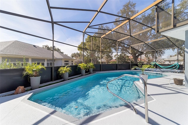 view of pool with a lanai and a patio