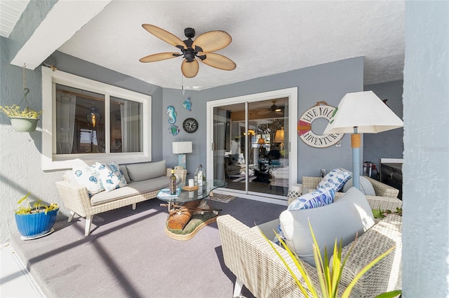 view of patio with outdoor lounge area and ceiling fan