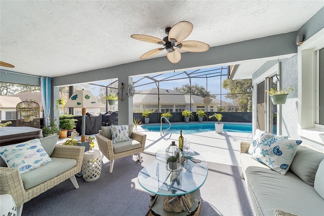 sunroom featuring ceiling fan and a swimming pool