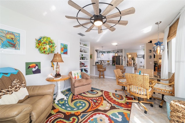 living room with light tile patterned flooring and ceiling fan