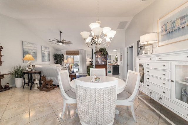 dining room featuring vaulted ceiling and ceiling fan with notable chandelier