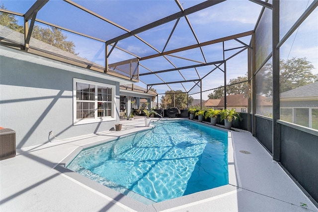 view of pool featuring a patio, glass enclosure, and central air condition unit