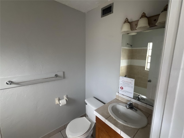 bathroom with vanity, toilet, and walk in shower