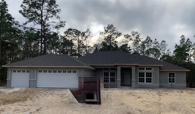 view of front of property with a garage