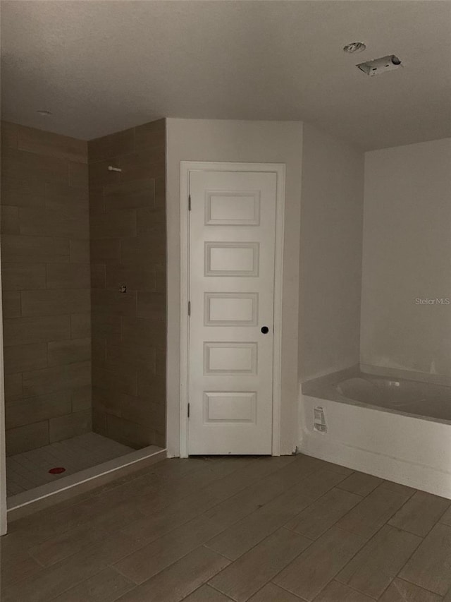 bathroom with shower with separate bathtub