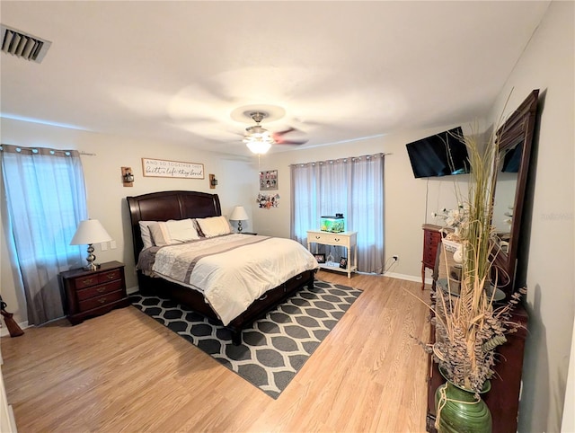 bedroom featuring ceiling fan and hardwood / wood-style floors