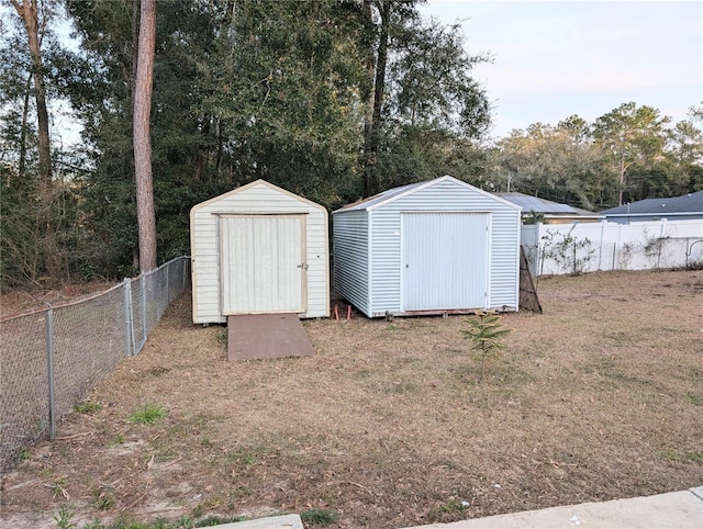 view of outbuilding featuring a yard