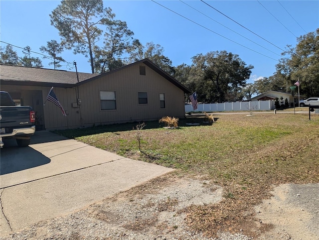 view of home's exterior with a lawn