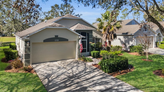 view of front of property featuring a garage and a front lawn