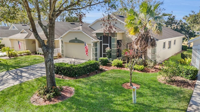 view of front facade with a garage and a front yard