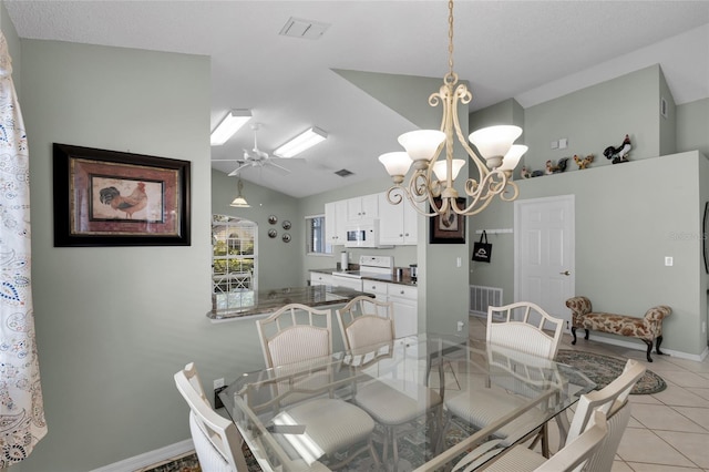 tiled dining space with lofted ceiling and ceiling fan with notable chandelier