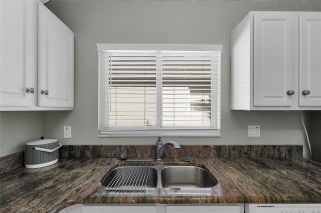 kitchen featuring white cabinetry, sink, and dishwasher