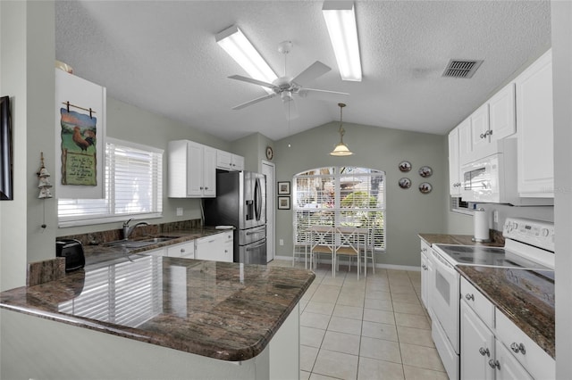 kitchen featuring white cabinetry, white appliances, sink, and light tile patterned floors