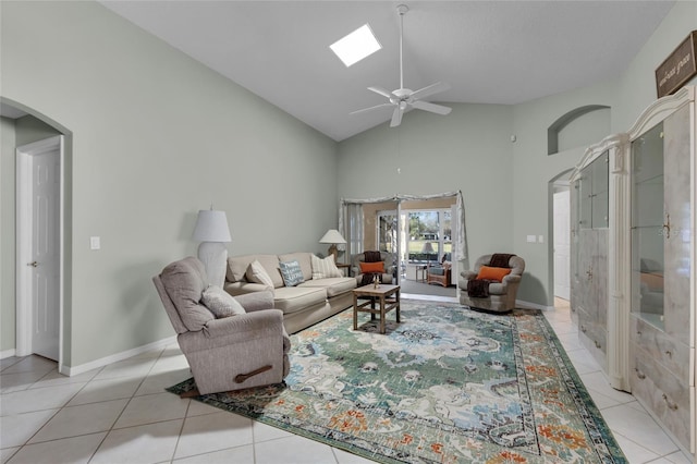 tiled living room with high vaulted ceiling and ceiling fan