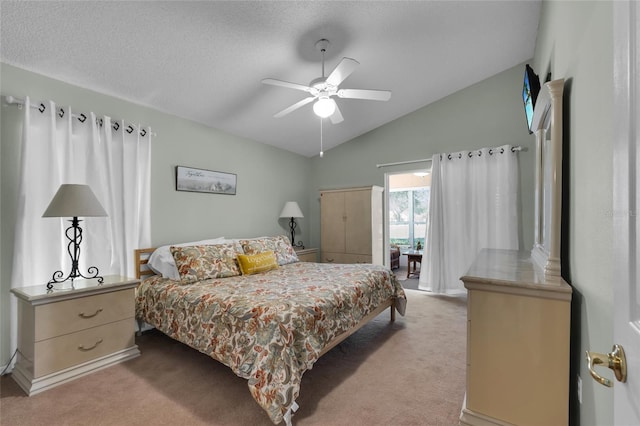 bedroom featuring vaulted ceiling, light carpet, ceiling fan, and a textured ceiling