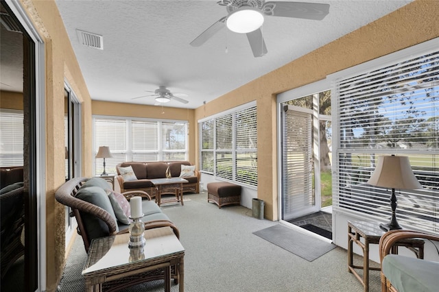 sunroom / solarium with ceiling fan