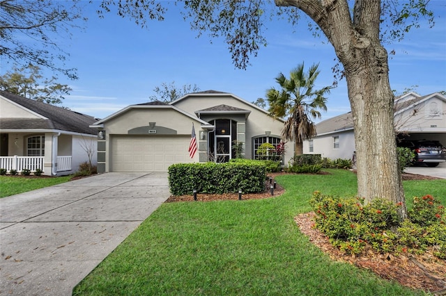 ranch-style house with a garage and a front yard