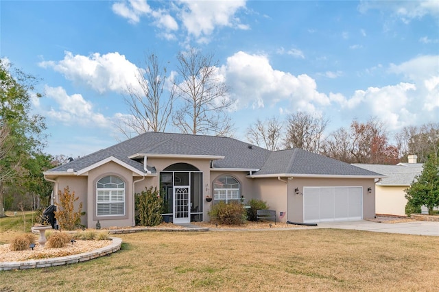 ranch-style house featuring a garage and a front lawn