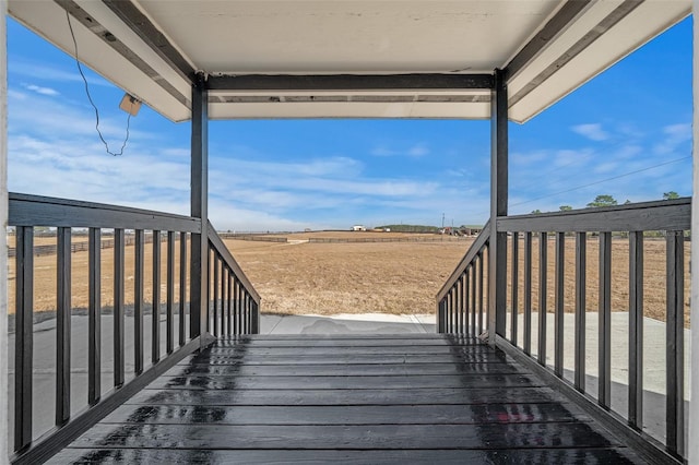 wooden terrace with a rural view